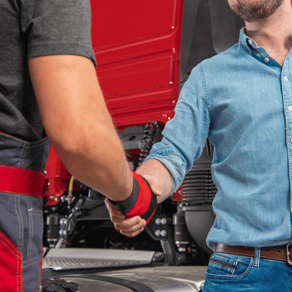 how to improve customer service: technician shaking hands with the driver's owner