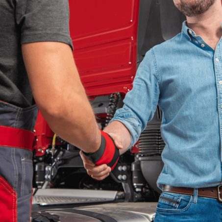 5(1) how to improve customer service: technician shaking hands with the driver's owner