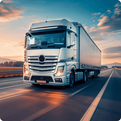 Modern semi-trailer truck driving on highway during sunset, representing efficient freight logistics