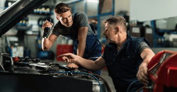 image-of-providing-feedabck(1) two male service technicians working