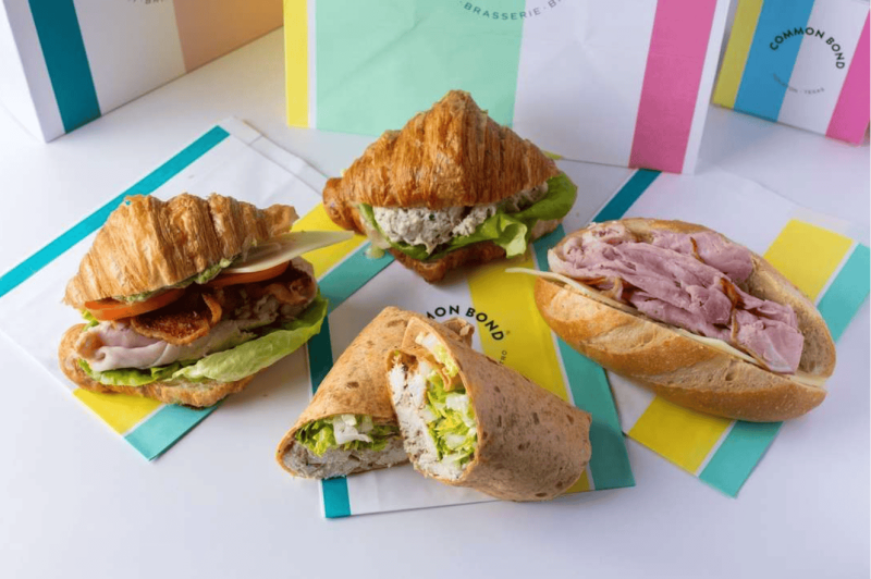 common-bond-restaurants in houston-2 Common Bond’s Chicken Caesar Wrap, Texas Club, Ham & Cheese, and Chicken Salad sandwiches in Houston