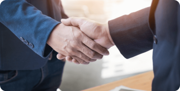 two-confident-business-man-shaking-hands-during-meeting-office-success-dealing-greeting-partner-concept Closing a deal banner - men shaking hands