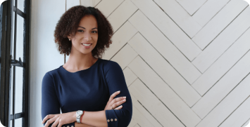 woman-with-curly-hair-smiling Operations manager at a dealership